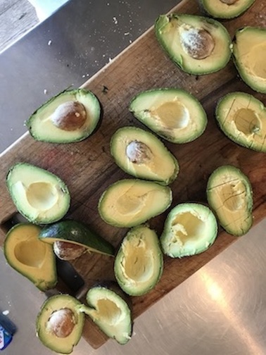 Birdview of avacados lying on table.